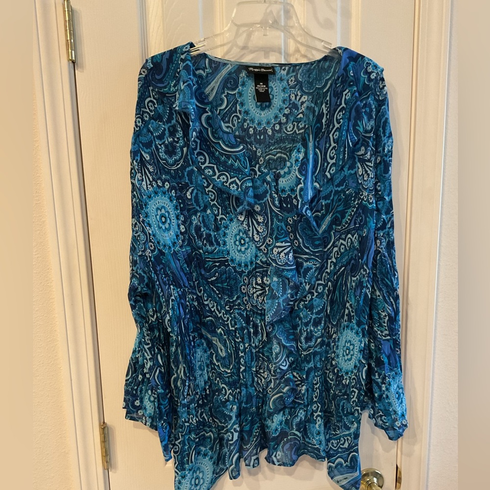 Flows blouse in vibrant blues.